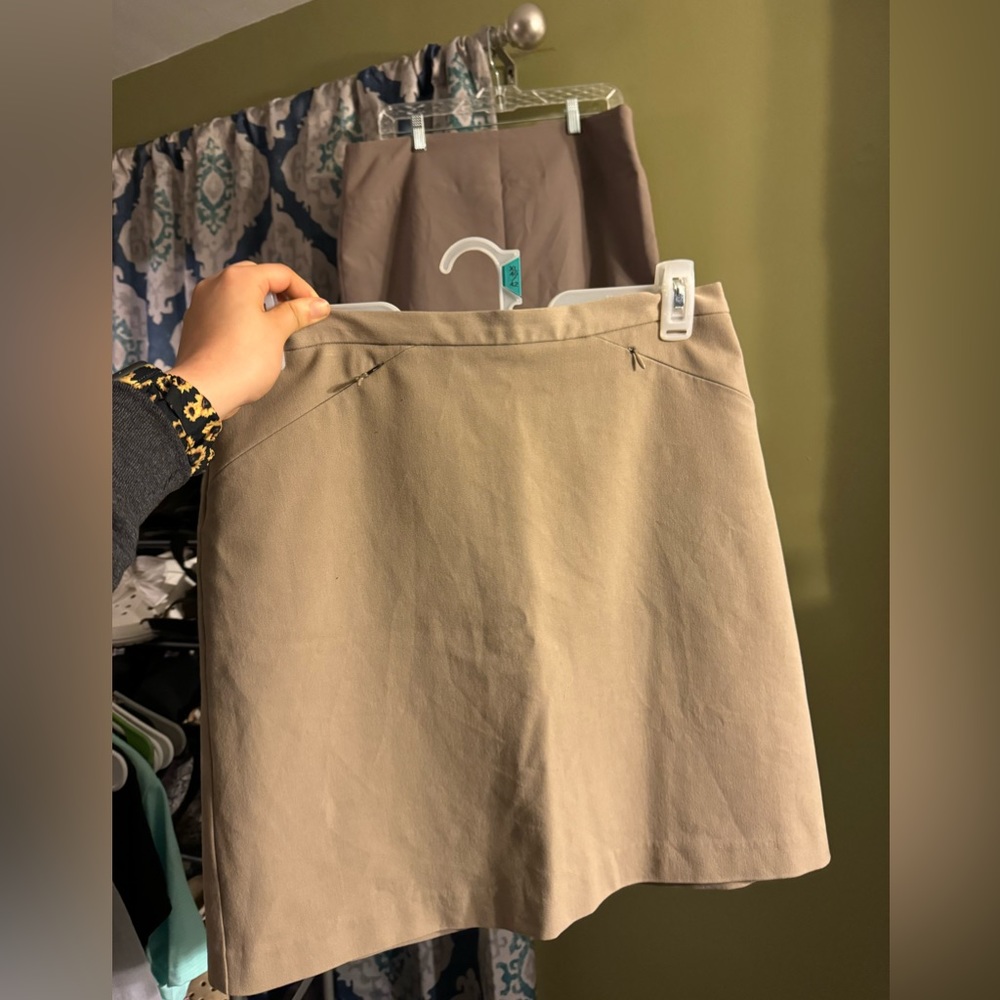 TWO tan pencil skirts